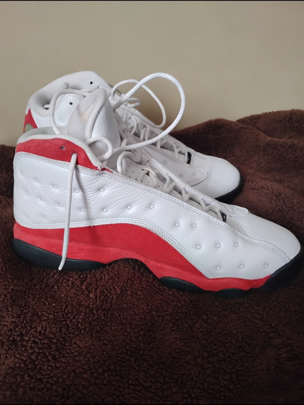 Jordan White High-Top Sneakers with Black Logo